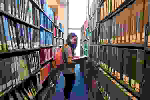 student in library