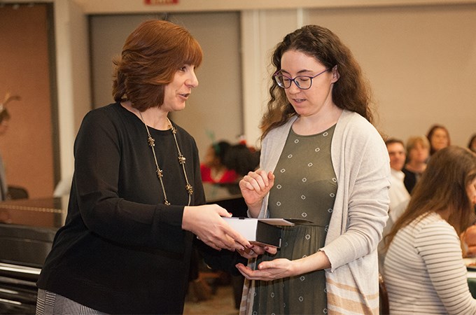 Michelle Rogers giving Emily Croft a President's Award