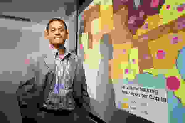 professor standing in front of a data map