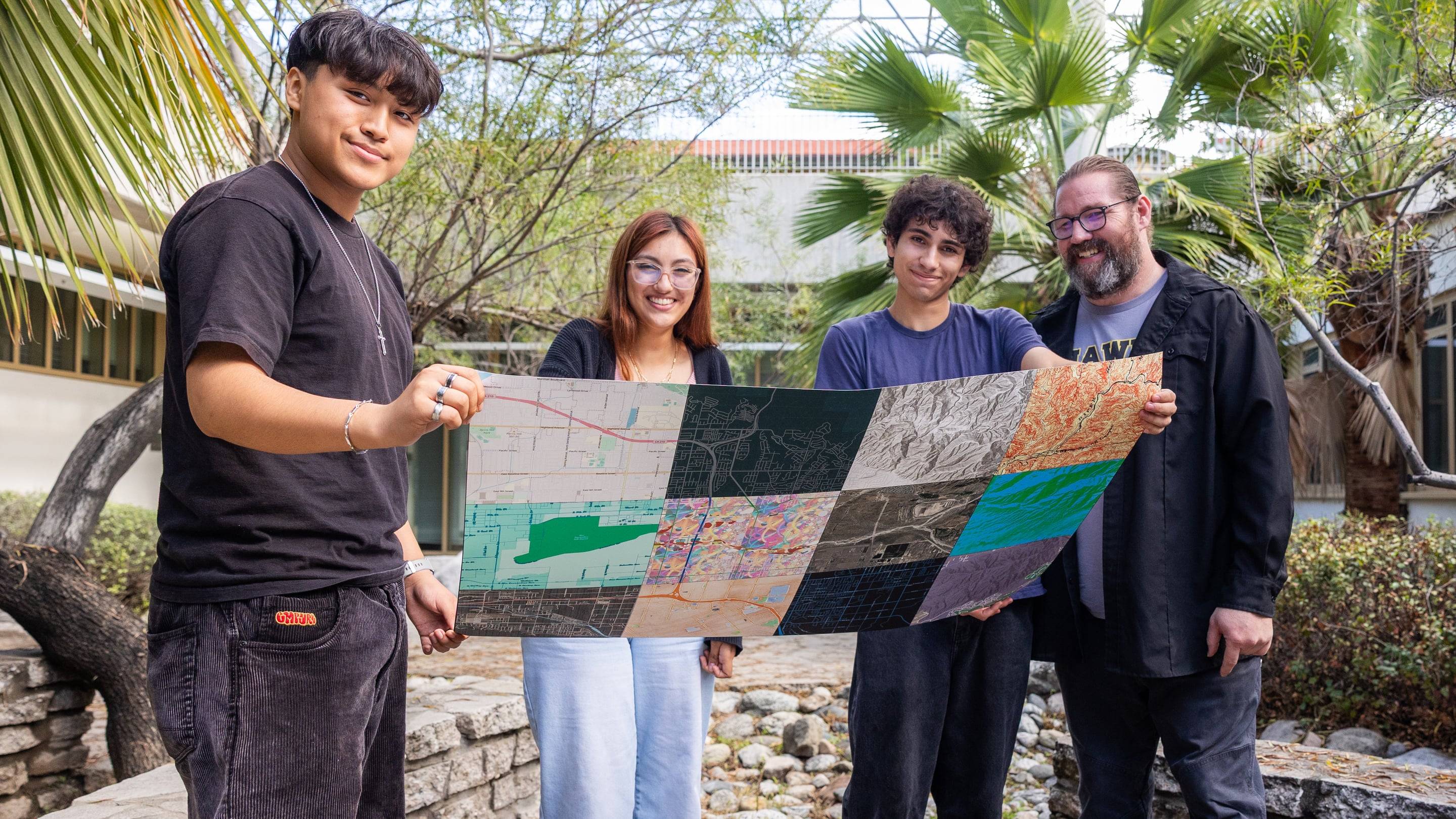 a group of people holding a map