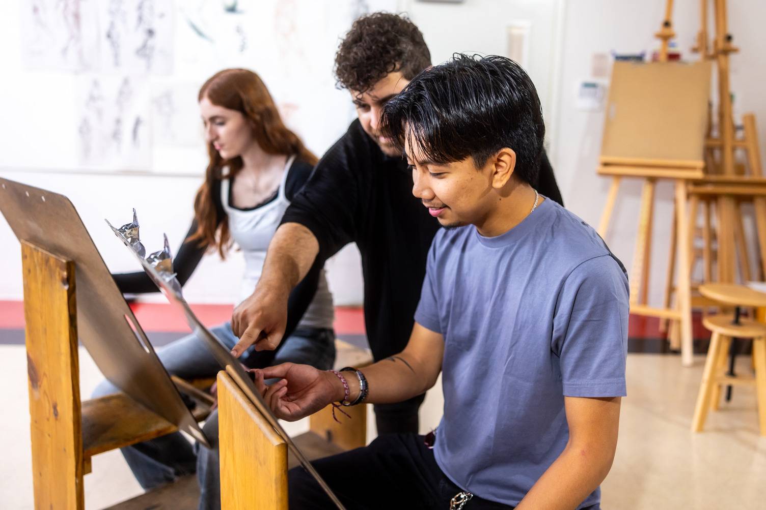 a group of people looking at a piece of paper
