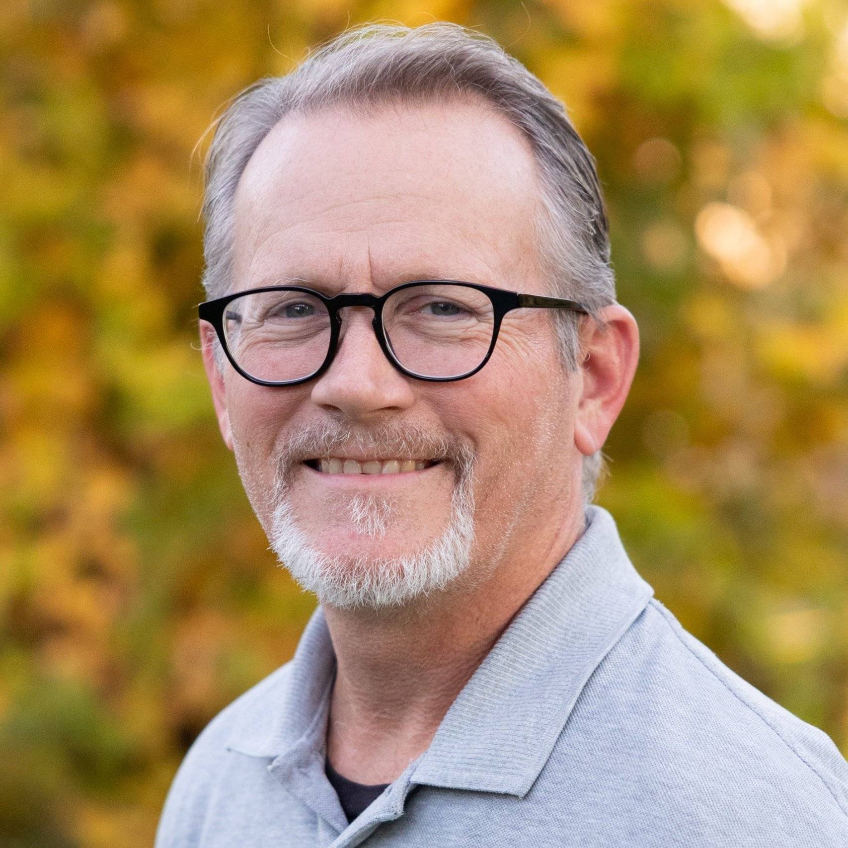 a person with glasses and a beard