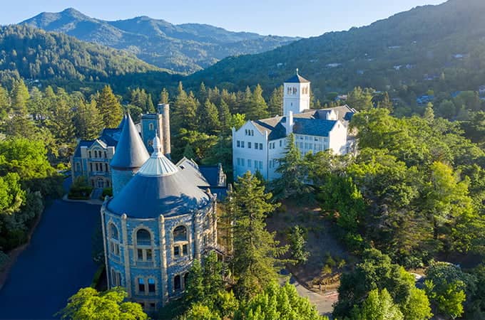 a large building surrounded by trees
