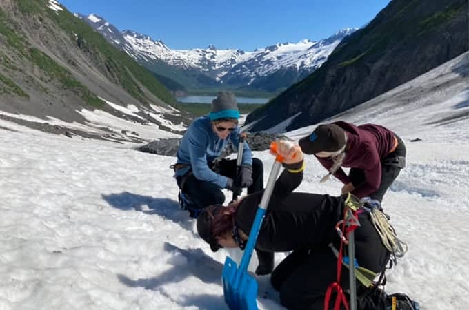 a group of people on a snowy mountain