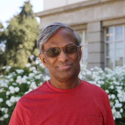 a person wearing sunglasses and a red shirt