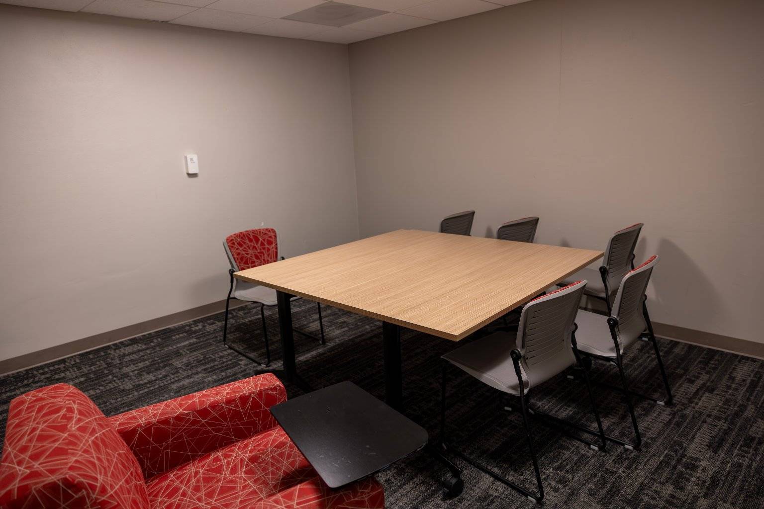 a room with a table and chairs
