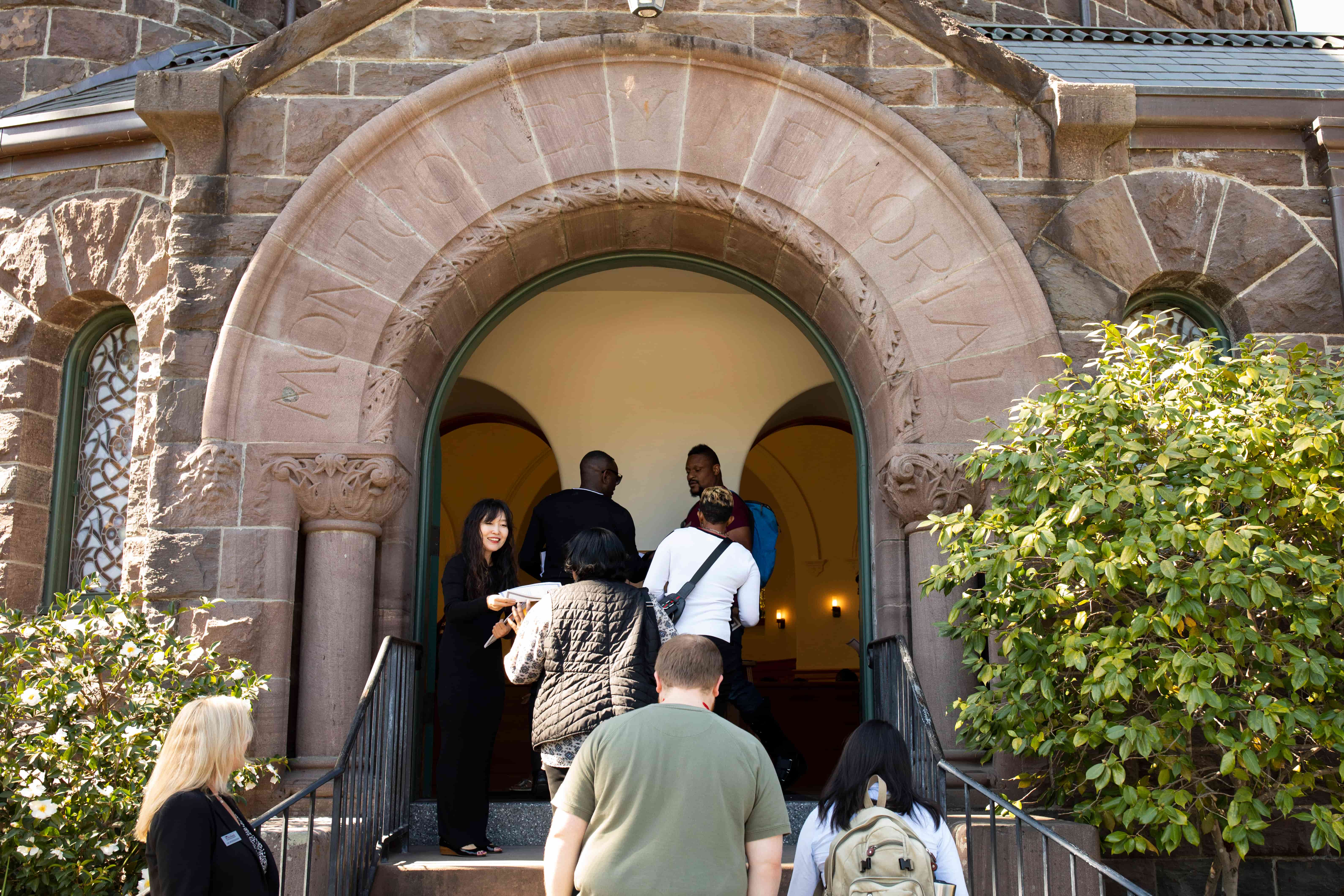 a group of people standing in a doorway