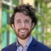 a person with a beard smiling