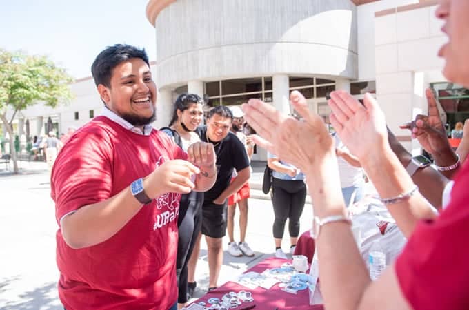 a group of people clapping hands