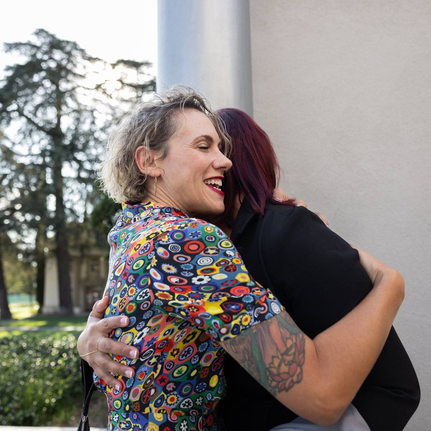 a person hugging another person outside