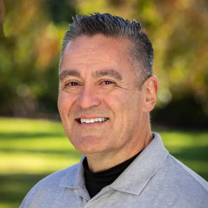 a person smiling at the camera