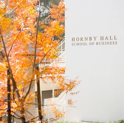 a white building with orange leaves