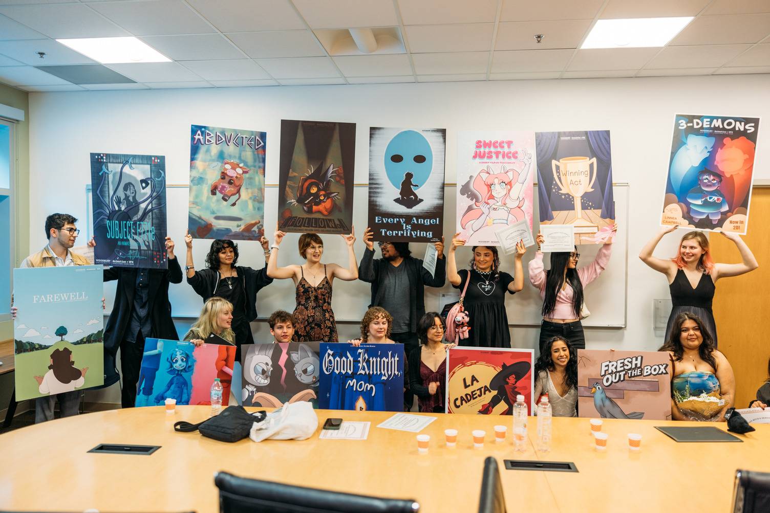 a group of people holding up posters