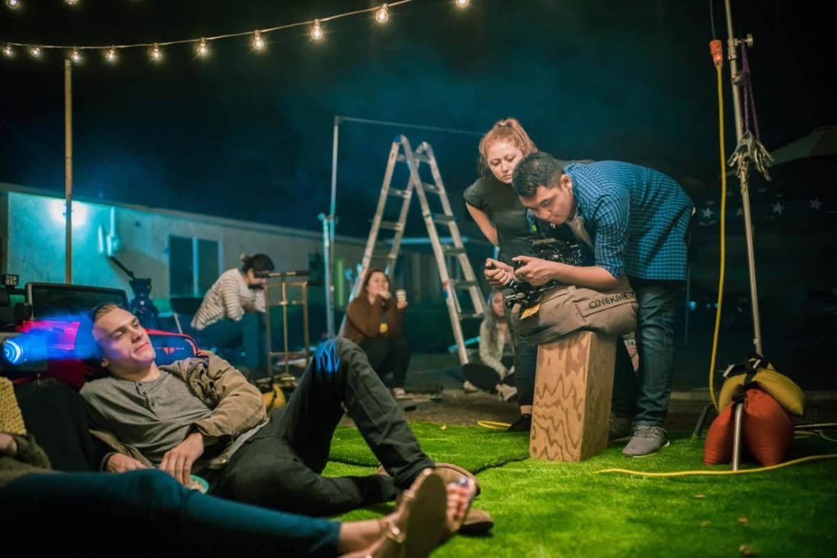 a group of people on a grass field