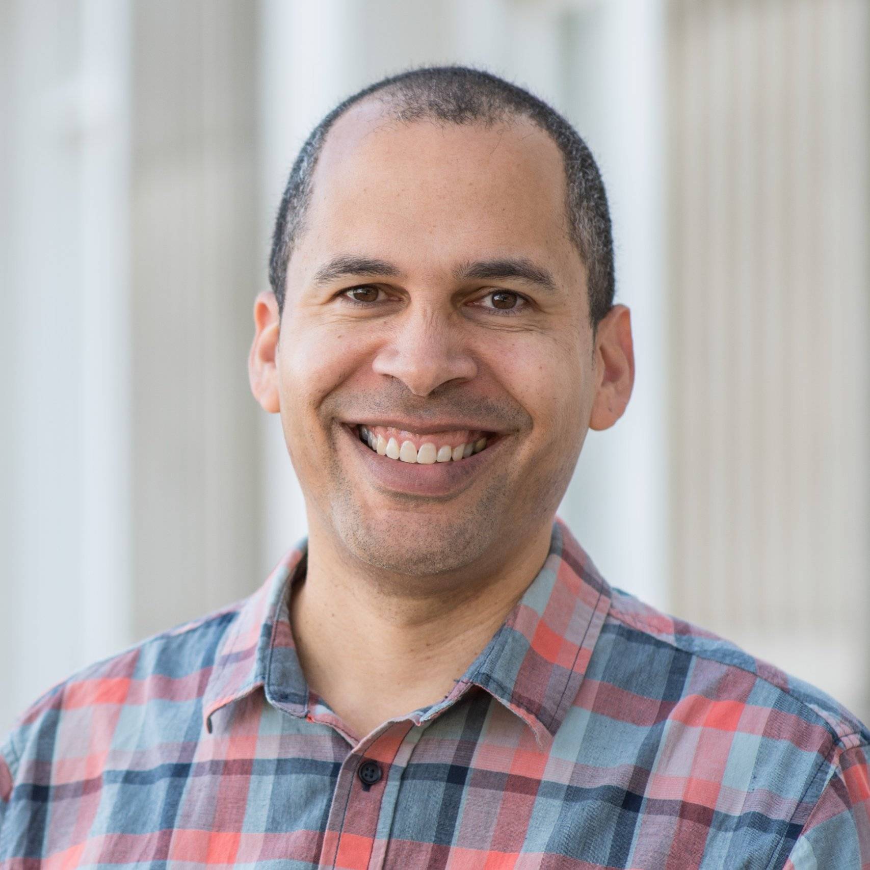 a person smiling at the camera