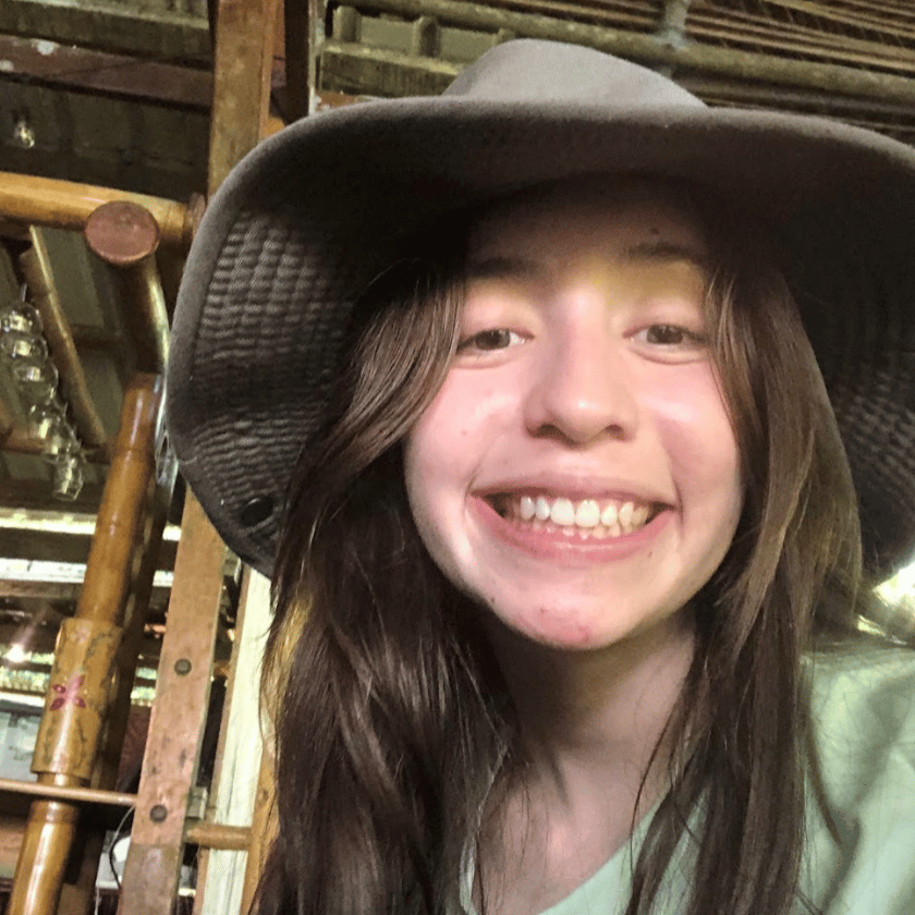 a child wearing a hat smiling