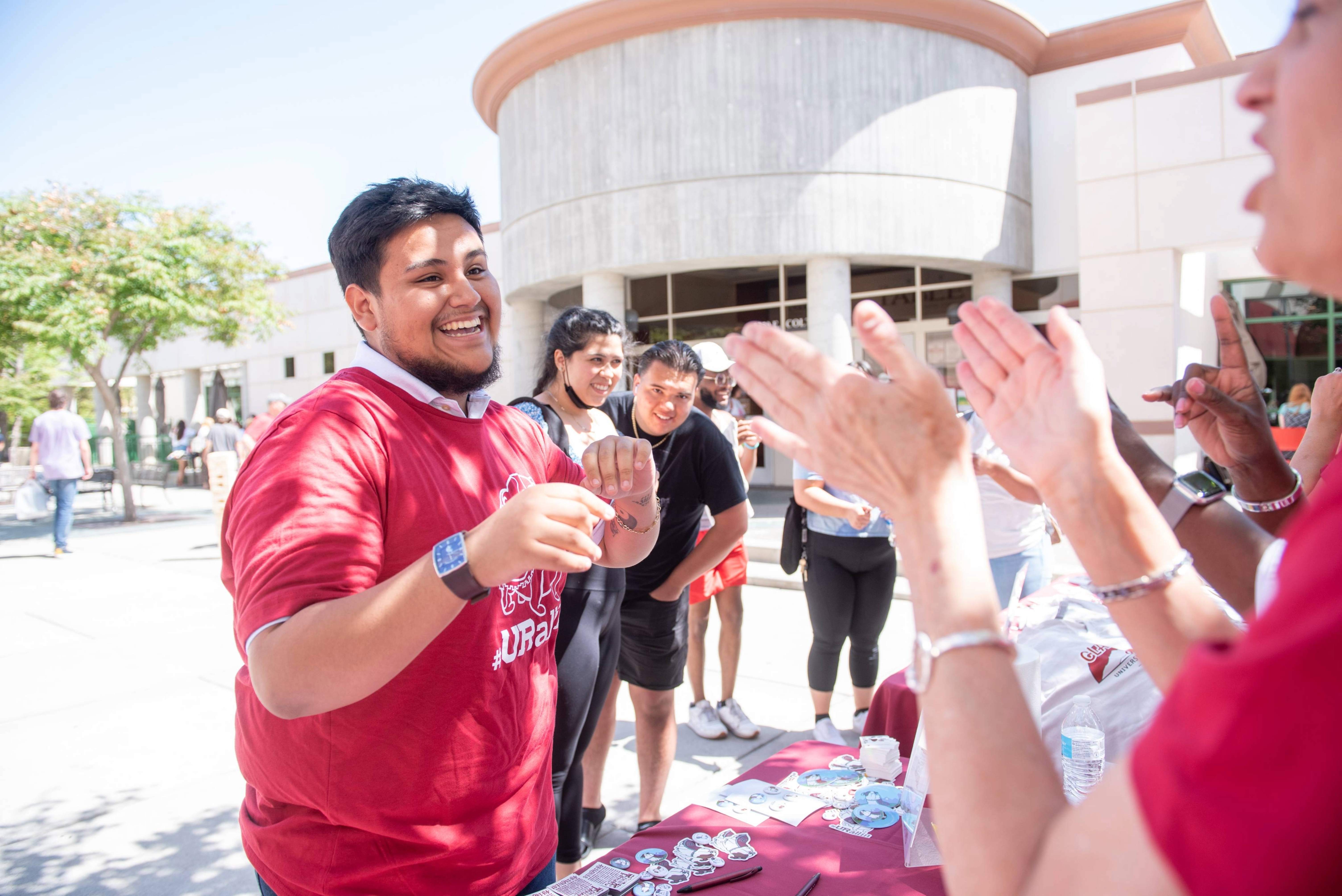 a person giving a high five to a person