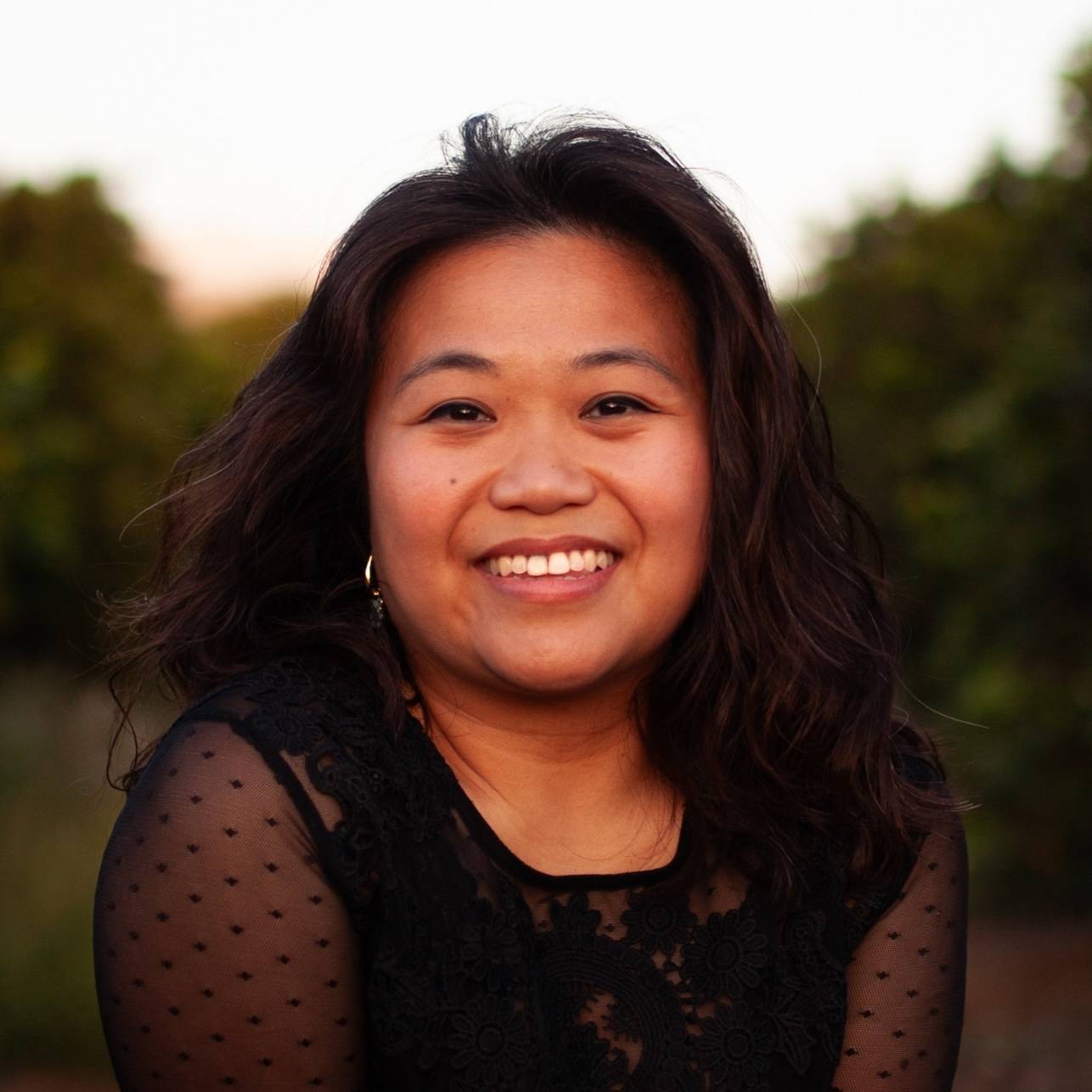 a person smiling at the camera