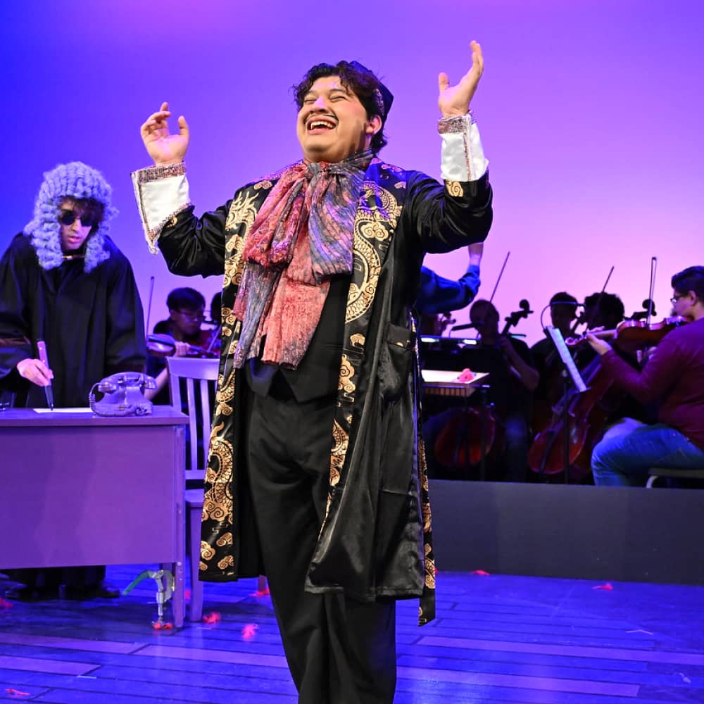 a person in a garment with his hands up