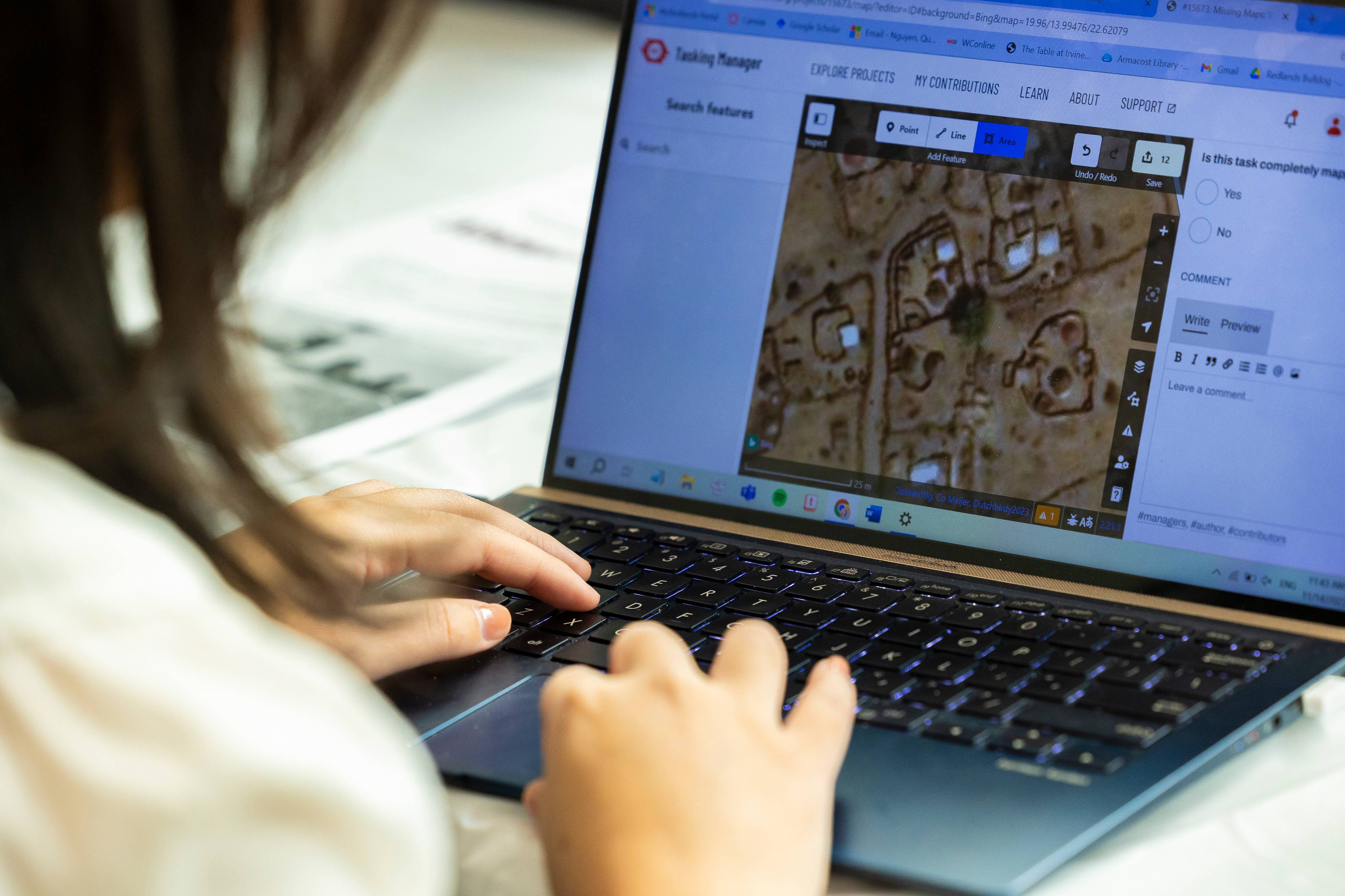 a person typing on a laptop