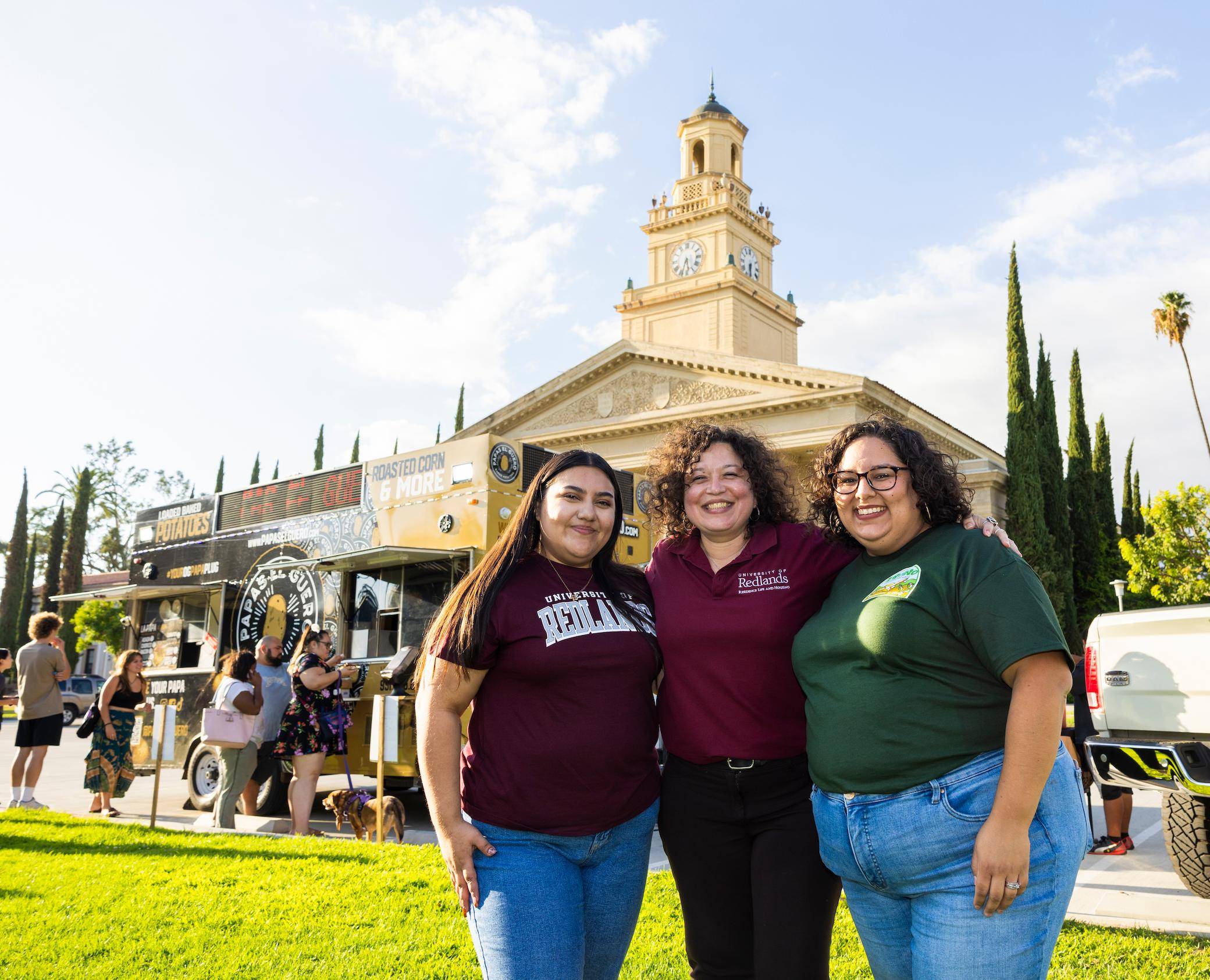a group of women standing in front of a building