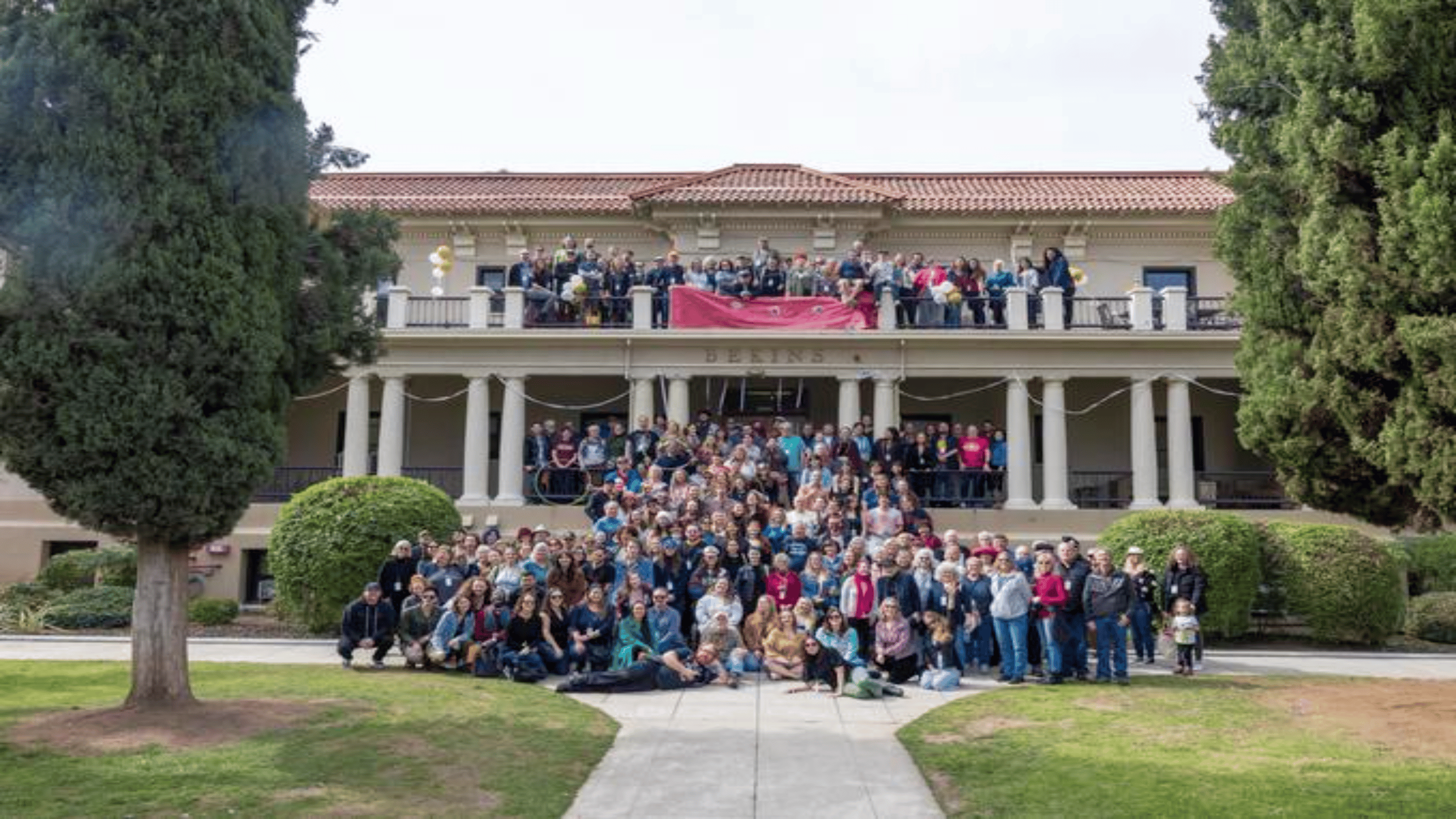 a large group of people posing for a photo