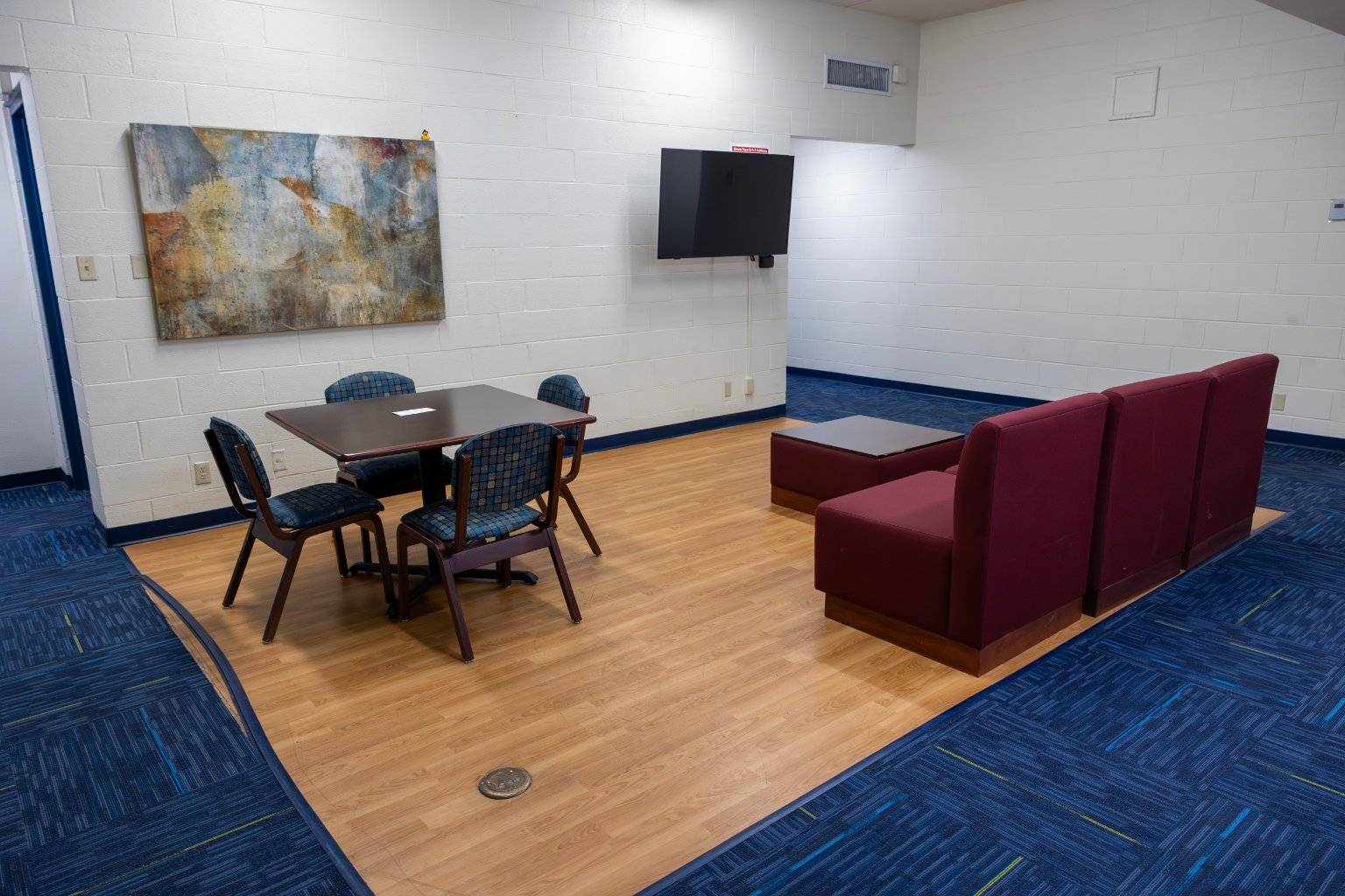 a room with a table and chairs