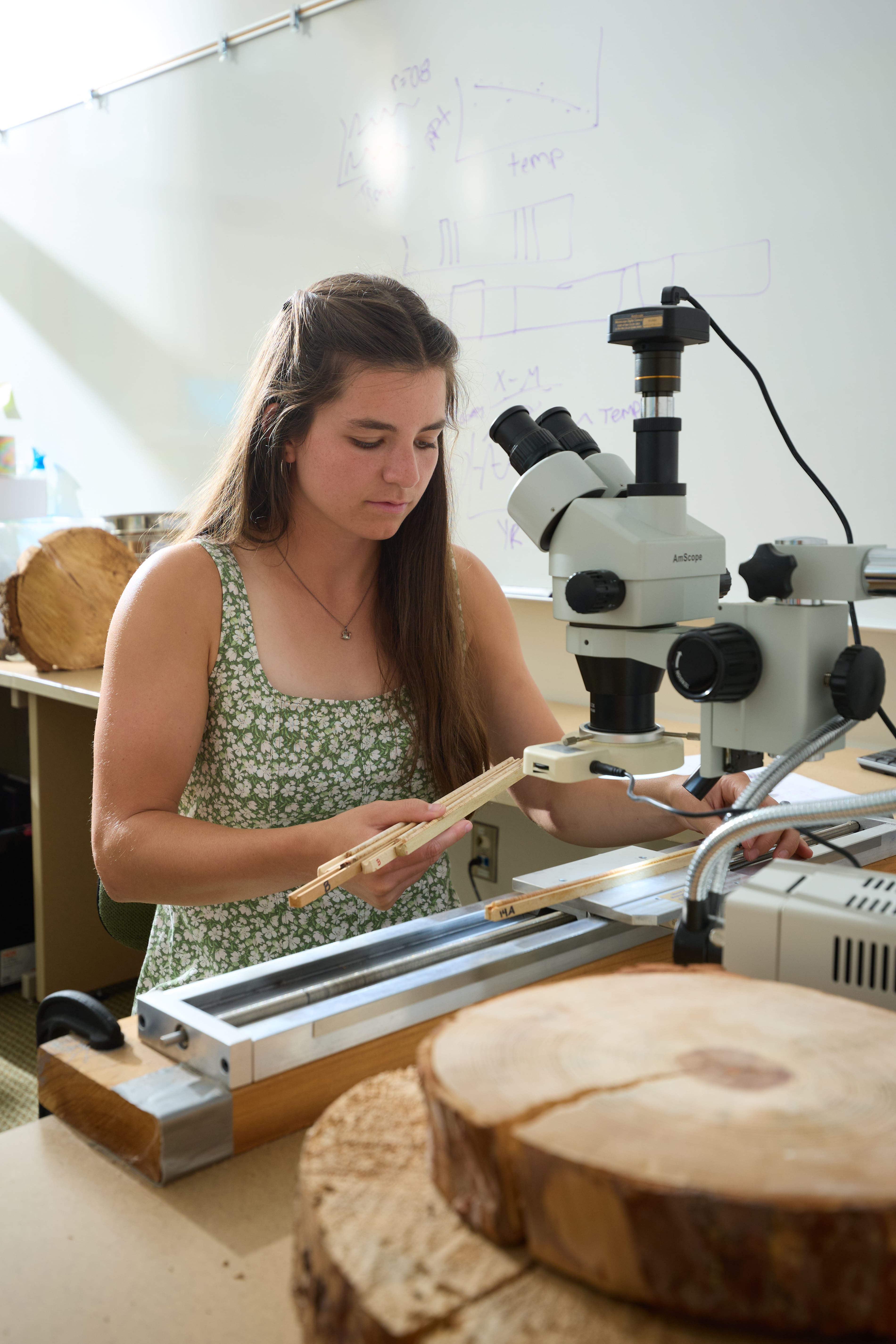 a person using a microscope