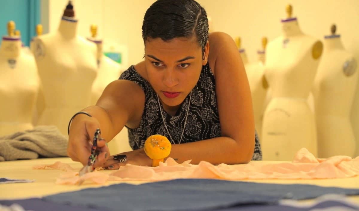a person working on a fabric