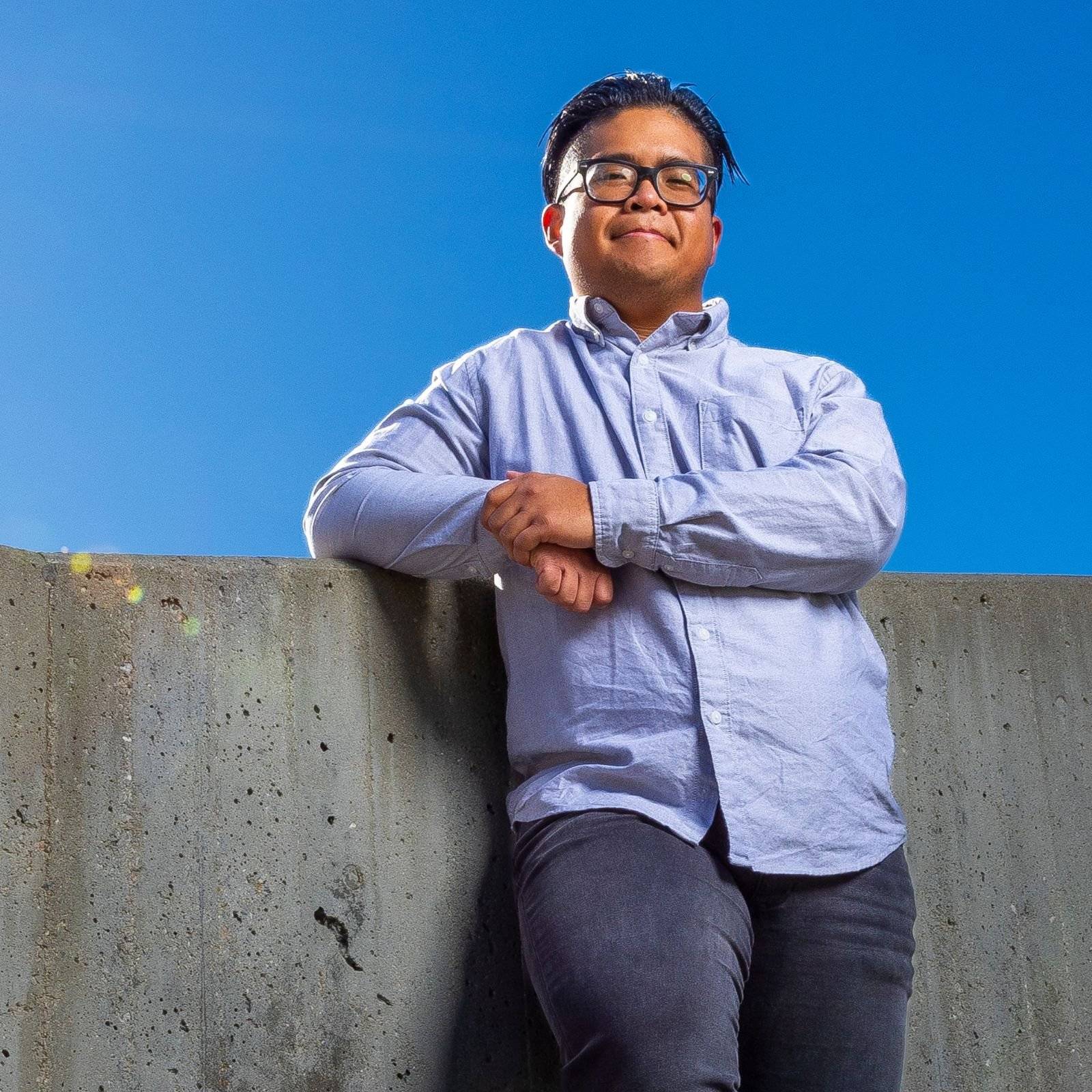 a person leaning on a wall