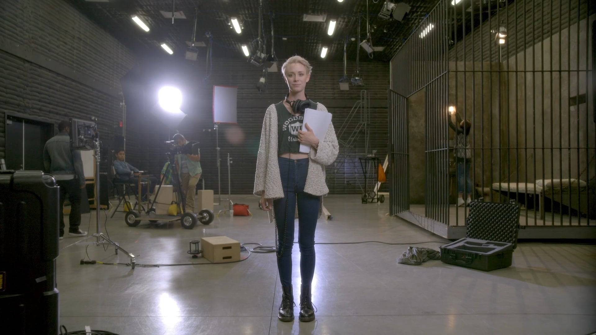 a person holding a clipboard and a microphone