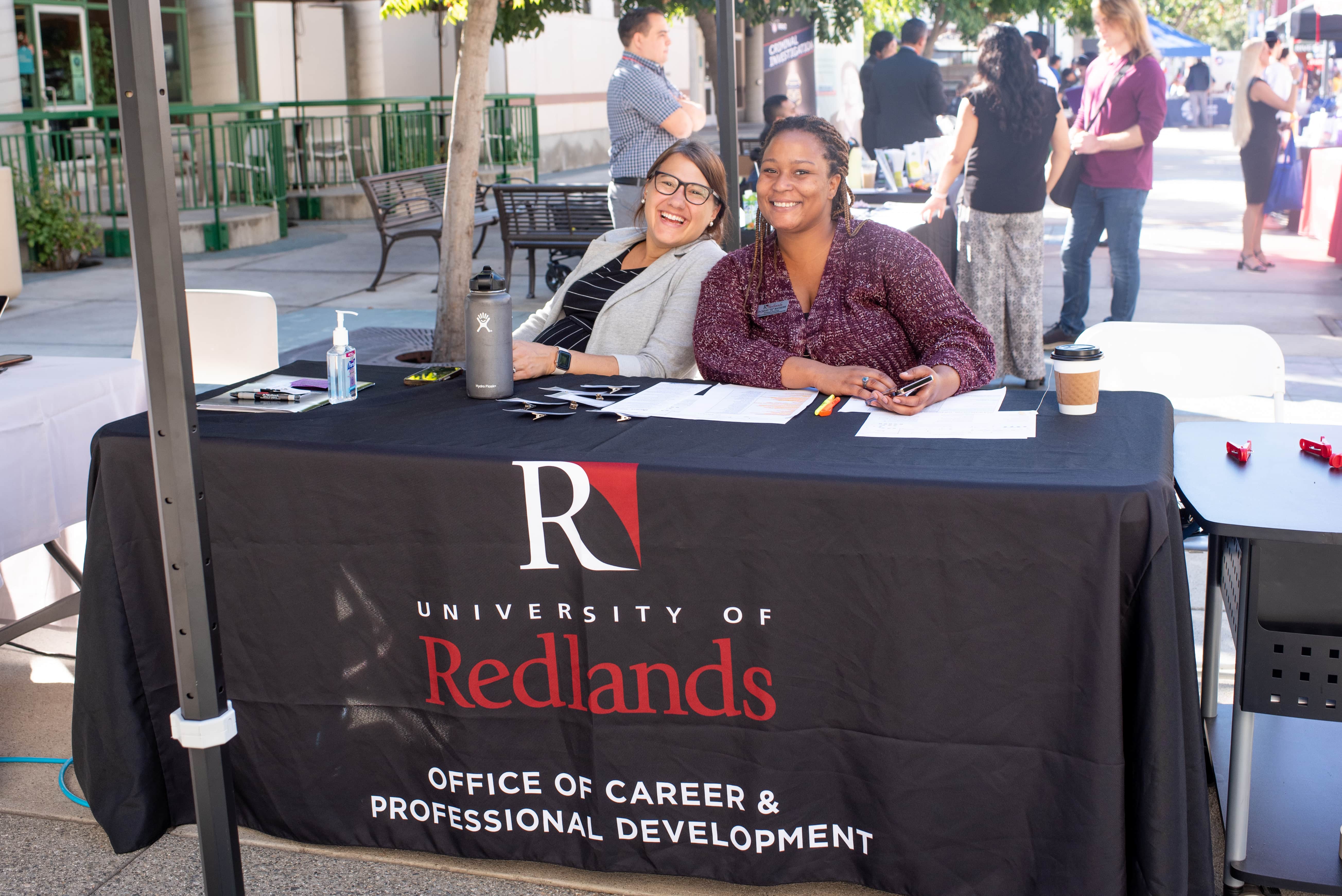 two women sitting at a table