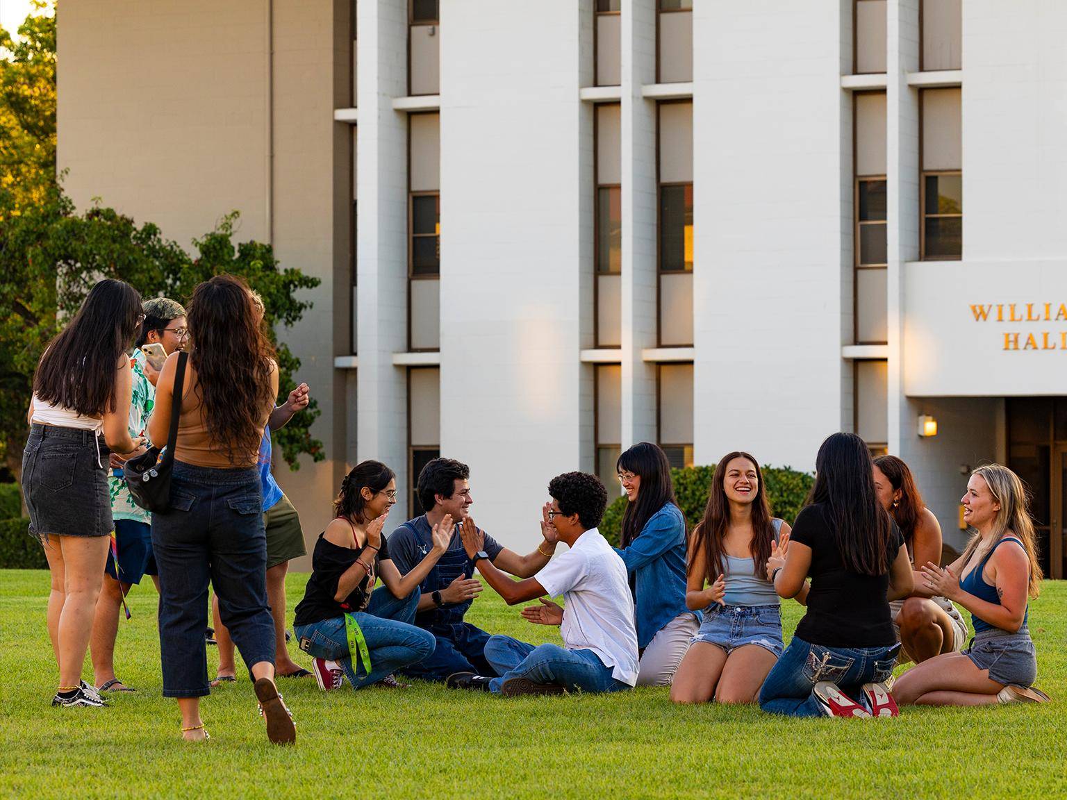 First-year students on grass outside of Williams Hall.