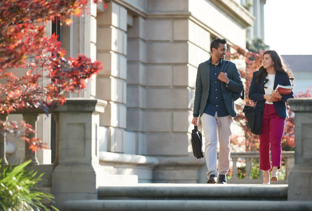a person and person walking down stairs
