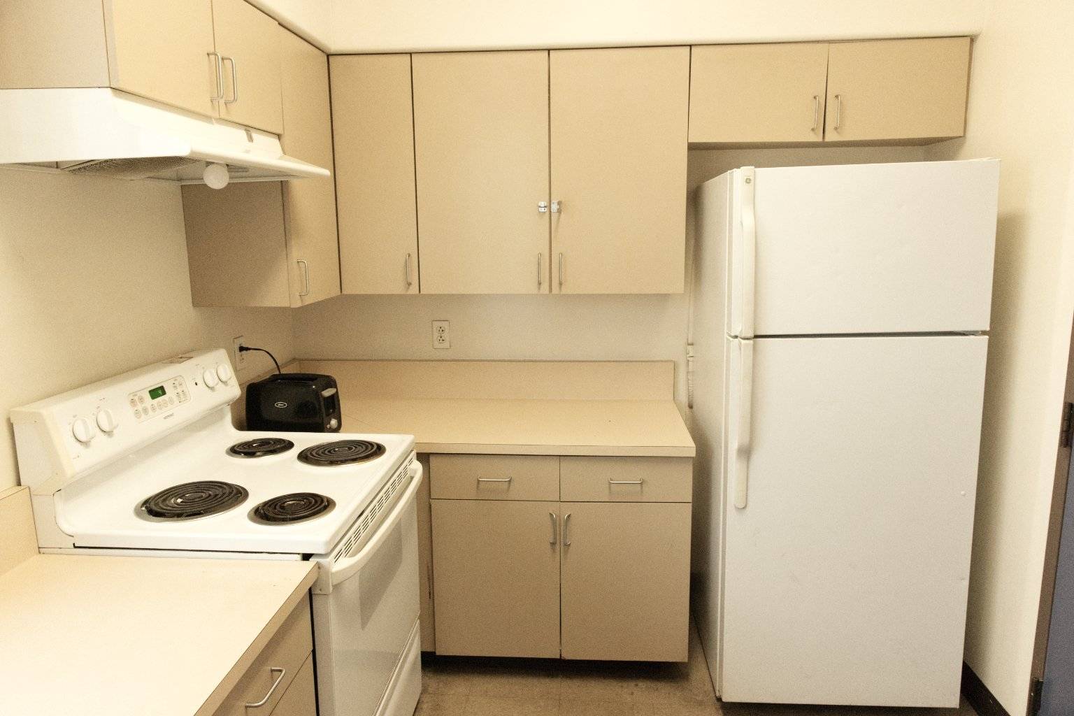 a kitchen with white appliances