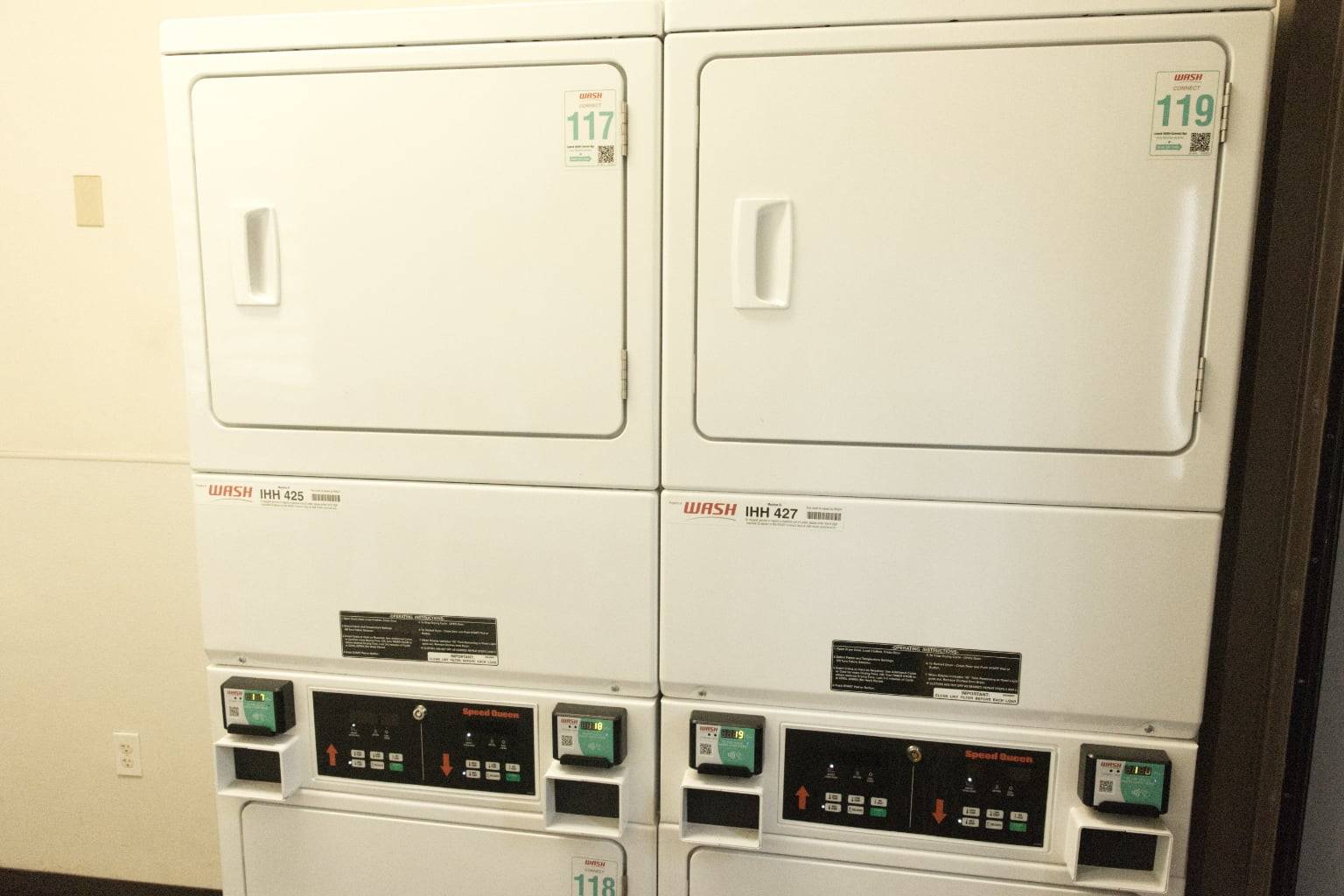 a group of white laundry machines