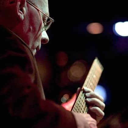 a person playing a guitar