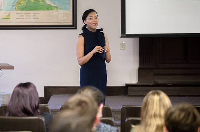 a person standing in front of a screen
