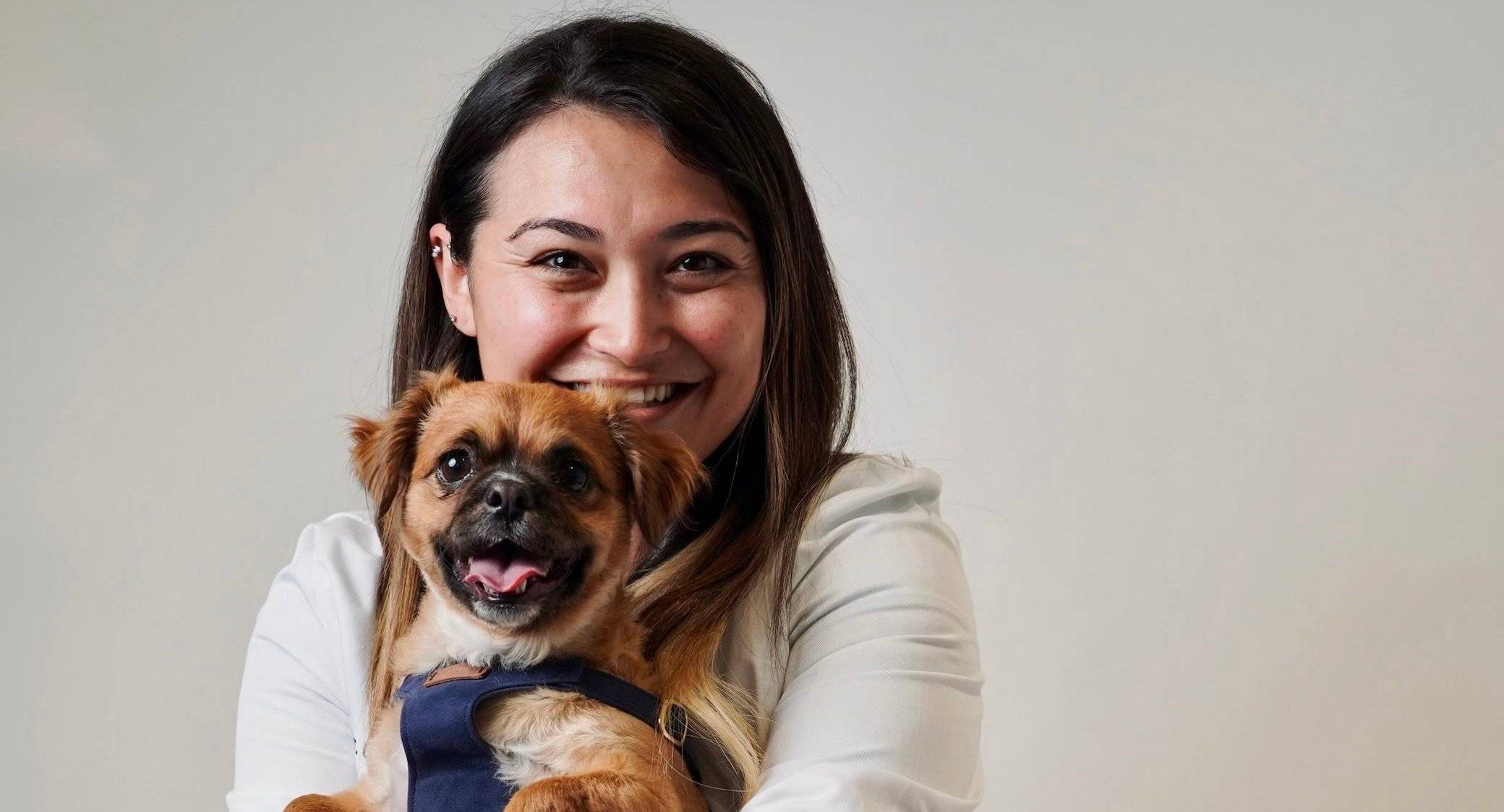 a person holding a dog