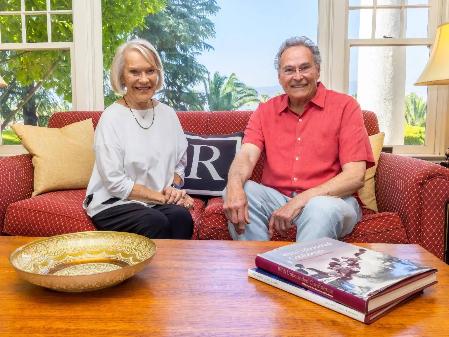 a person and person sitting on a couch