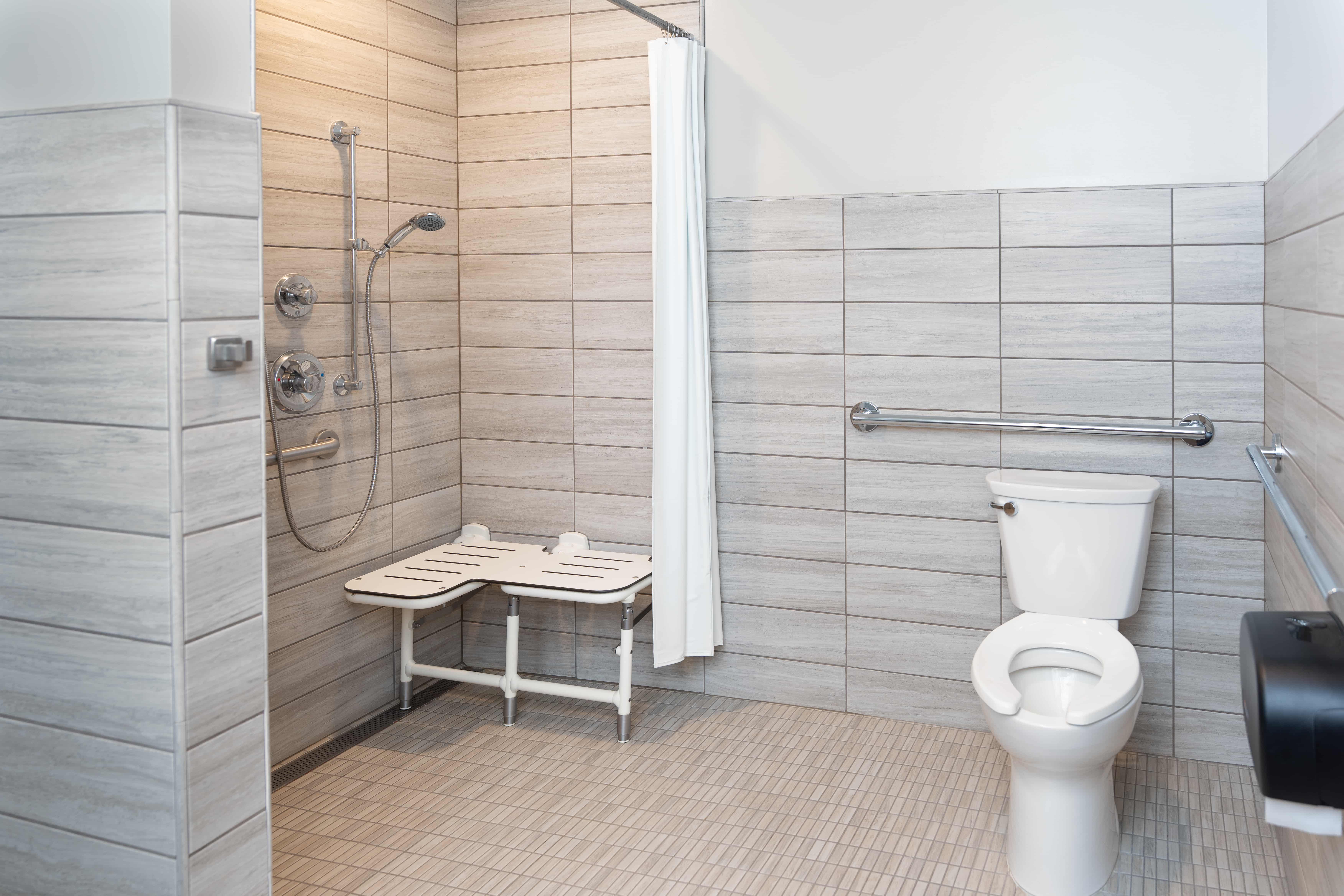 a bathroom with a shower and toilet