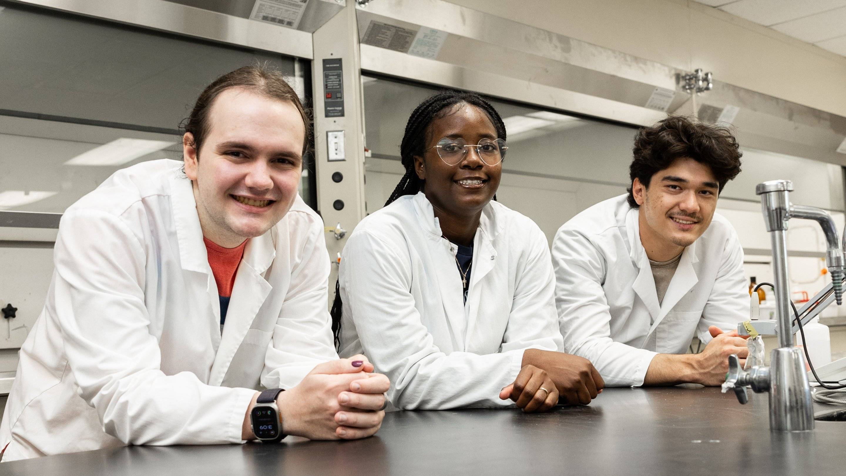 a group of people in lab coats