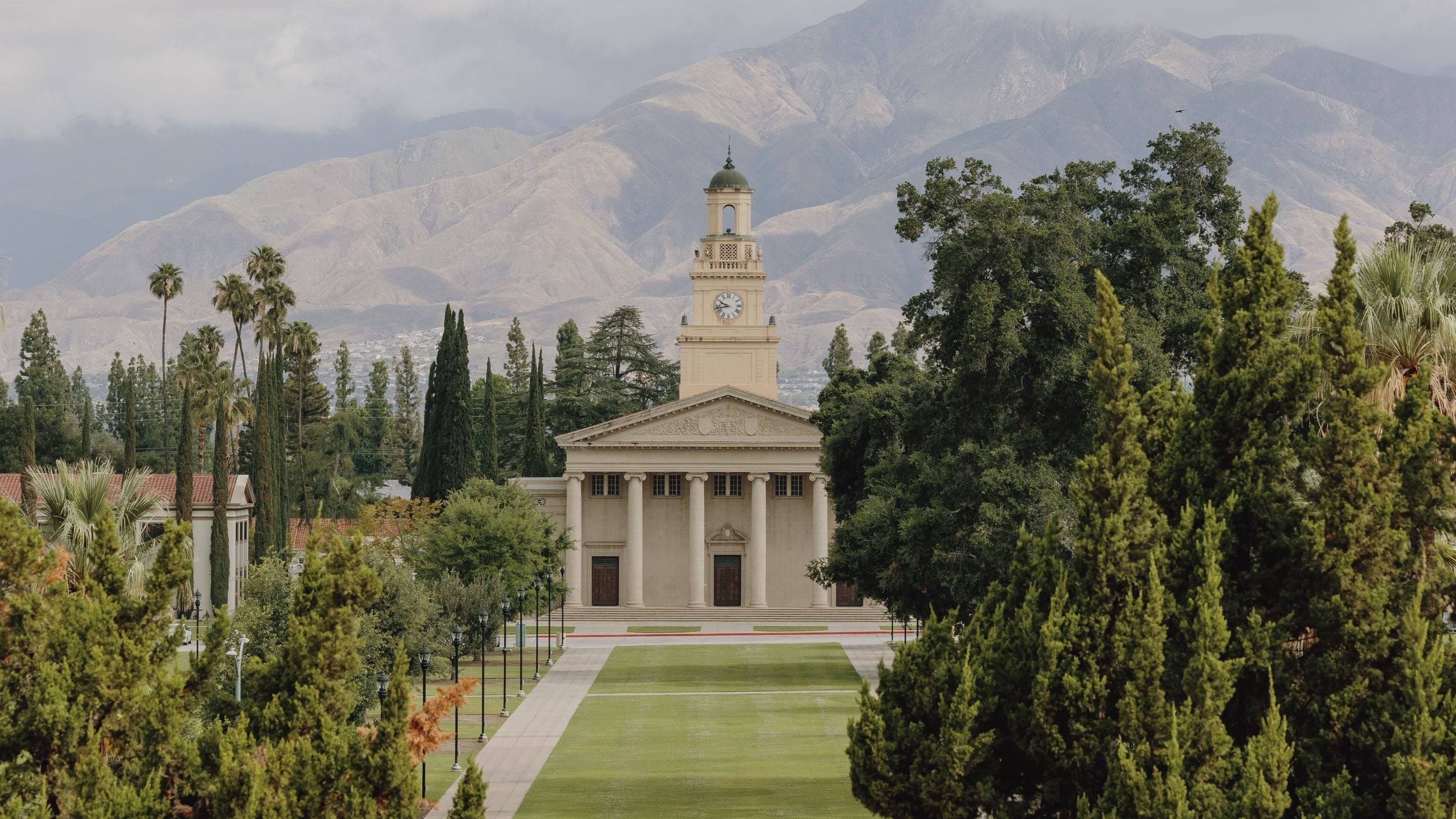 a building with a clock tower and trees