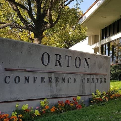 a sign in front of a building