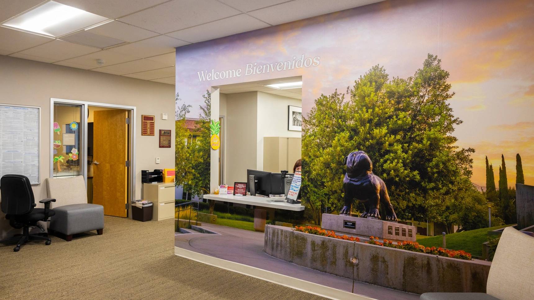 a wall mural of a building with a picture of a reptile