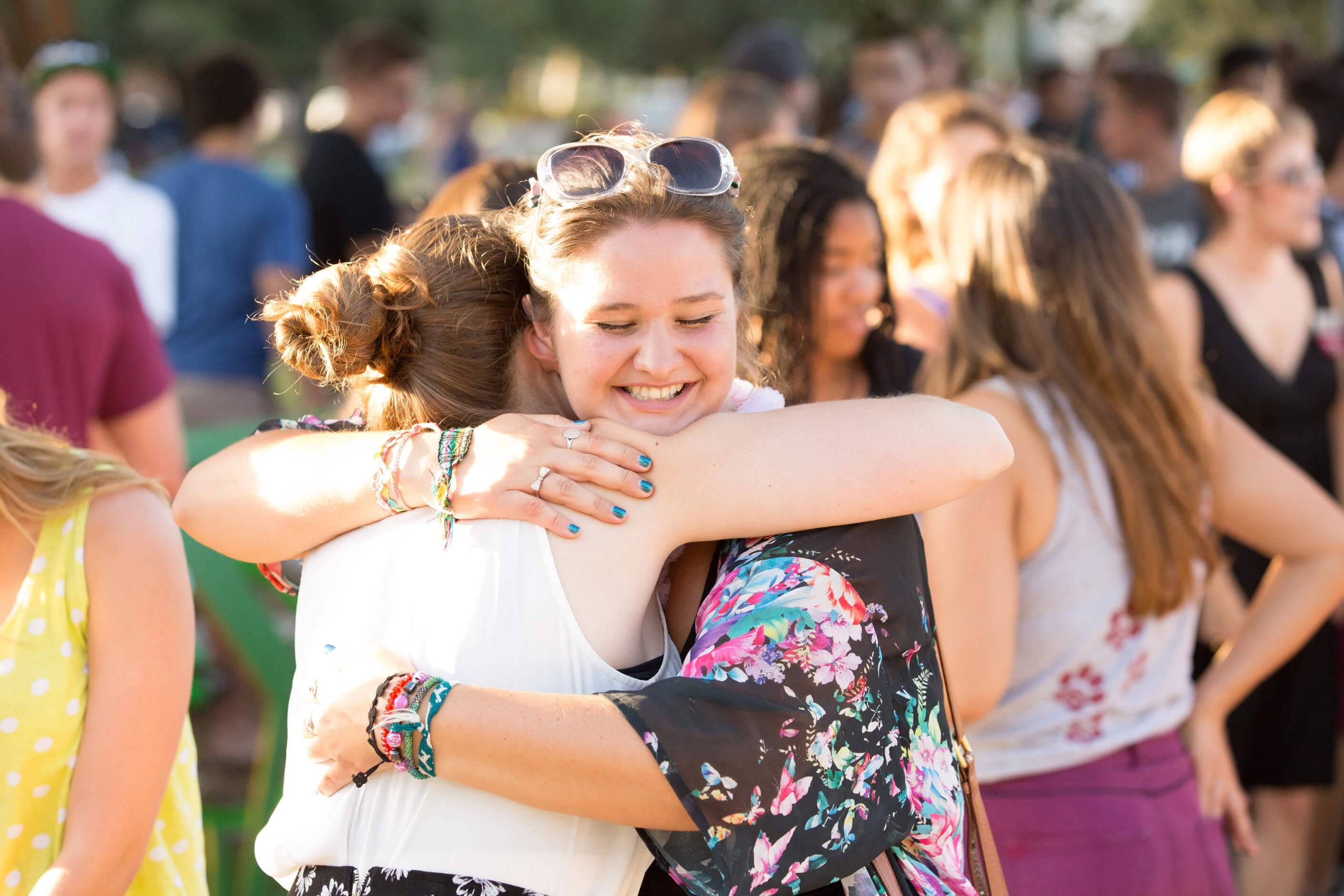 a person hugging another person