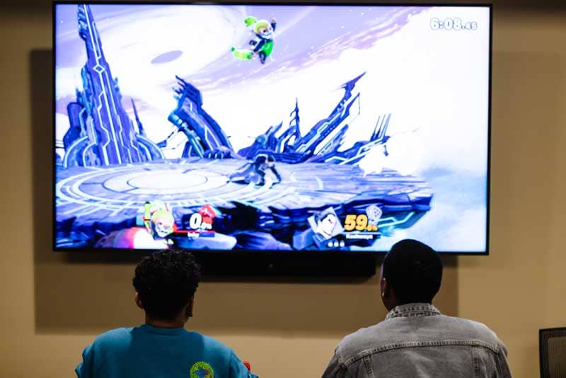 a group of people watching a video game