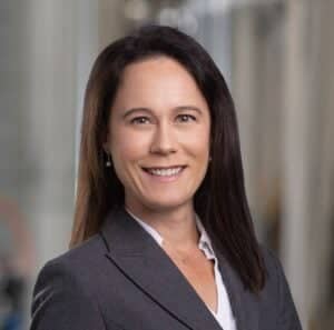 a person in a suit smiling