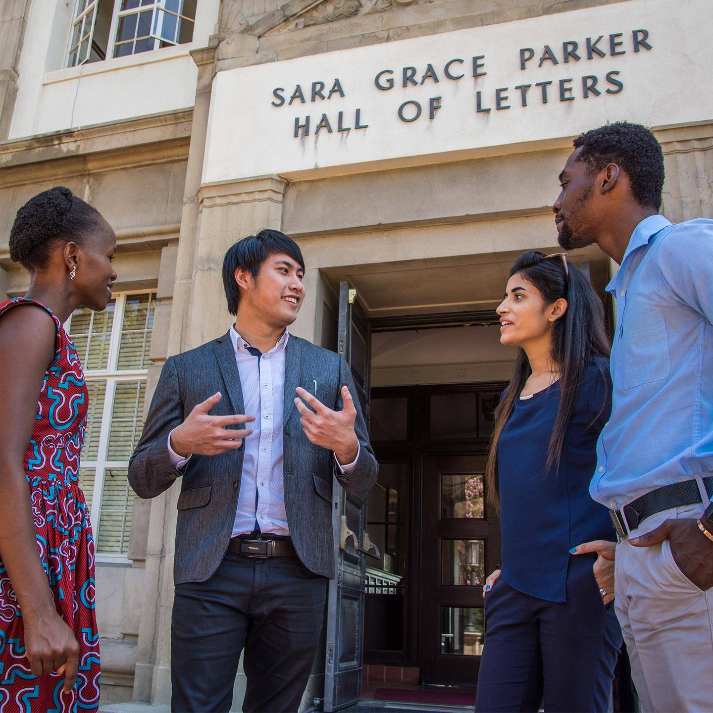 a group of people standing outside a building