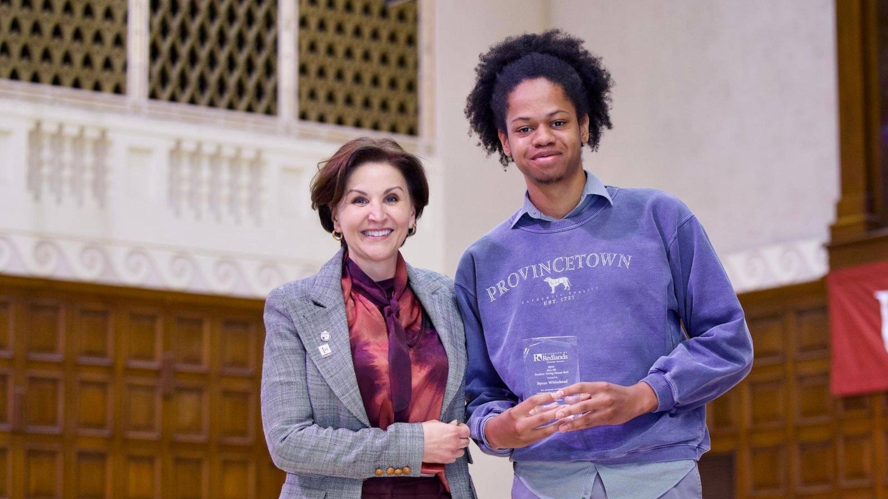 a person and person holding a trophy